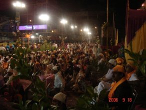 Attendees sitting on chairs in front of Parkash of Guru Granth Sahib