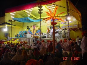 Attendees Sitting on chairs in front of Guru Granth Sahib Ji, while Sri Harmandir Sahib Head Granthi Gurbachan Singh hobnobs with pro-RSS members