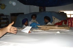 Rubbish and litter stored on top of Saroops of Guru Granth Sahib Ji stacked like bricks.