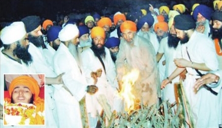 The Martyrs funeral pyre being lit by family members