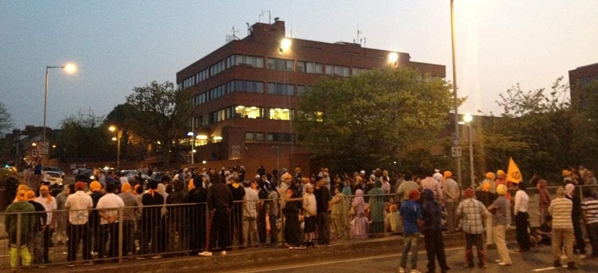 Sikhs block off a main road outside Luton Police station in protest against an attack on a Punjabi girl
